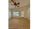 Bright living room with tile floors and sliding glass door at 22233 N 76Th Dr, Peoria, AZ 85383