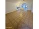 Open living room with tile floors and access to kitchen at 22233 N 76Th Dr, Peoria, AZ 85383