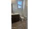 Bathroom with a vanity, a mirror and ceramic tile flooring at 22319 W Monona Ln, Surprise, AZ 85387
