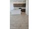 Open kitchen with stainless steel appliances, an island, white quartz countertops, and dark wood cabinets at 22319 W Monona Ln, Surprise, AZ 85387