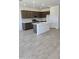 Open kitchen with stainless steel appliances, an island, white quartz countertops, and dark wood cabinets at 22319 W Monona Ln, Surprise, AZ 85387