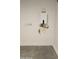 Water heater in the garage with concrete floors and plain white walls at 22319 W Monona Ln, Surprise, AZ 85387