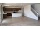 Bright kitchen open to the living area, featuring an island, stainless steel appliances, and modern finishes at 22327 W Monona Ln, Surprise, AZ 85387
