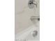 Close-up of a bathtub and shower fixtures with marble wall at 25350 W Sunland Ave, Buckeye, AZ 85326