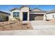 One-story house with attached garage and desert landscaping at 25359 W Sunland Ave, Buckeye, AZ 85326