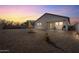 Backyard features gravel, patio furniture, and a view of the house at 25587 N Boreas Rd, Florence, AZ 85132