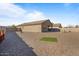 Landscaped backyard with gravel, artificial turf, and patio area at 25587 N Boreas Rd, Florence, AZ 85132