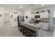 Modern kitchen with white cabinets, granite island, and stainless steel appliances at 25587 N Boreas Rd, Florence, AZ 85132