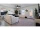 Living room with gray sofa, coffee table, and sliding glass door to backyard at 25587 N Boreas Rd, Florence, AZ 85132