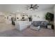 Living room with gray sofa, coffee table, and ceiling fan at 25587 N Boreas Rd, Florence, AZ 85132