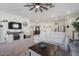 Living room with beige carpet, sofa, coffee table, and ceiling fan at 25587 N Boreas Rd, Florence, AZ 85132