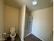 Bathroom with toilet and a large glass-enclosed shower at 25603 W Hedgehog Rd, Wittmann, AZ 85361