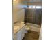 Second bathroom with granite vanity, tub/shower, and tile floor at 25603 W Hedgehog Rd, Wittmann, AZ 85361