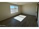 Secondary bedroom with tile floors and a window at 25603 W Hedgehog Rd, Wittmann, AZ 85361