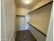 Large walk-in closet with built-in shelving at 25603 W Hedgehog Rd, Wittmann, AZ 85361