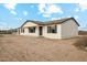 Single-story home with neutral color palette and charming curb appeal at 25603 W Hedgehog Rd, Wittmann, AZ 85361