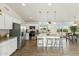 Modern kitchen with stainless steel appliances and a large kitchen island at 25603 W Hedgehog Rd, Wittmann, AZ 85361