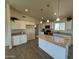 Spacious kitchen with granite countertops and white cabinetry at 25603 W Hedgehog Rd, Wittmann, AZ 85361