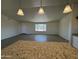 Kitchen features granite countertops and a view of the living room at 25603 W Hedgehog Rd, Wittmann, AZ 85361