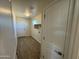 Laundry room with tile flooring and ample shelving at 25603 W Hedgehog Rd, Wittmann, AZ 85361