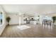 Open-concept living space with kitchen island, dining area, and great natural light at 25603 W Hedgehog Rd, Wittmann, AZ 85361