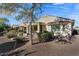 Backyard view of home with patio and landscaping at 26637 W Irma Ln, Buckeye, AZ 85396