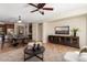 Living room with media console, coffee table and access to backyard at 26637 W Irma Ln, Buckeye, AZ 85396