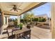 Covered patio with seating area and view of backyard at 26637 W Irma Ln, Buckeye, AZ 85396