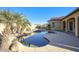 Enjoy this curved pool with a large patio area and shade at 28548 N 68Th Ave, Peoria, AZ 85383