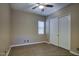 Spacious bedroom with tile floors and double doors at 28548 N 68Th Ave, Peoria, AZ 85383