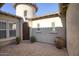 Private courtyard entry with brick pavers and potted plants at 28548 N 68Th Ave, Peoria, AZ 85383