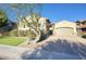 Single-story home with a large driveway and landscaped front yard at 28548 N 68Th Ave, Peoria, AZ 85383