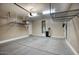 Garage with overhead storage racks and water softener at 28548 N 68Th Ave, Peoria, AZ 85383