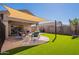 Artificial turf and covered patio with seating at 2925 E Tonto Dr, Gilbert, AZ 85298