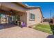 Backyard with covered patio, artificial turf, and storage at 2925 E Tonto Dr, Gilbert, AZ 85298