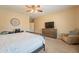 Spacious bedroom with a metal bed frame and dresser at 2925 E Tonto Dr, Gilbert, AZ 85298