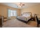 Bedroom with metal bed frame and carpet flooring at 2925 E Tonto Dr, Gilbert, AZ 85298