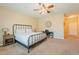 Bedroom with a metal bed frame, dresser, and carpet flooring at 2925 E Tonto Dr, Gilbert, AZ 85298