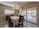 Dining room with sliding glass doors leading to a backyard patio at 2925 E Tonto Dr, Gilbert, AZ 85298