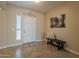 Inviting entryway with tiled floor, bench, and wall art at 2925 E Tonto Dr, Gilbert, AZ 85298