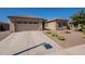 Two-car garage and front yard landscaping highlight this one-story home at 2925 E Tonto Dr, Gilbert, AZ 85298