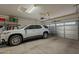 Garage with car, storage, and basketball hoop at 2925 E Tonto Dr, Gilbert, AZ 85298