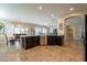 Spacious kitchen with an island, stainless steel appliances, and dark cabinetry at 2925 E Tonto Dr, Gilbert, AZ 85298