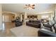 Open living area with leather furniture and view into kitchen at 2925 E Tonto Dr, Gilbert, AZ 85298