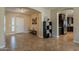 Open concept living room, kitchen view, and leather furniture at 2925 E Tonto Dr, Gilbert, AZ 85298