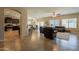 Open living room with dark leather furniture and tile floors at 2925 E Tonto Dr, Gilbert, AZ 85298