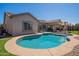 Beautiful kidney-shaped pool with a spacious patio at 2925 E Tonto Dr, Gilbert, AZ 85298