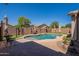 Inviting kidney-shaped pool with surrounding patio at 2925 E Tonto Dr, Gilbert, AZ 85298