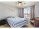 Guest bedroom with striped bedding and ample natural light at 29875 N Sedona Pl, San Tan Valley, AZ 85143