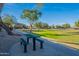 Green metal picnic table with benches in grassy area at 29875 N Sedona Pl, San Tan Valley, AZ 85143